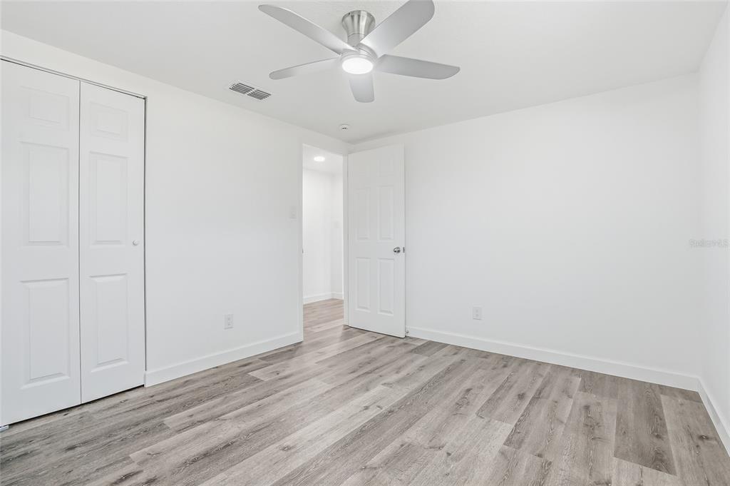 7840 Gulf Way Hudson, FL 34667 - Photo 25 of 37 wooden floor in an empty room