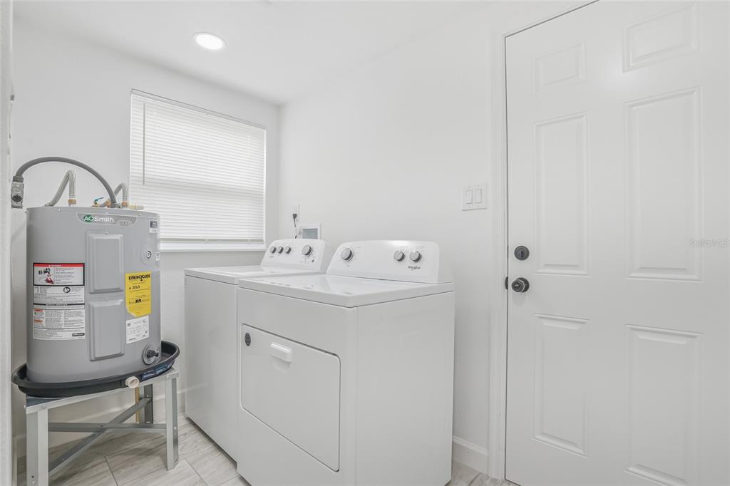 7840 Gulf Way Hudson, FL 34667 - Photo 28 of 37 a utility room with dryer and washer