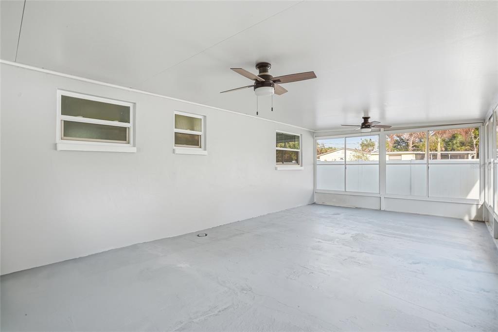 7840 Gulf Way Hudson, FL 34667 - Photo 29 of 37 an empty room with windows