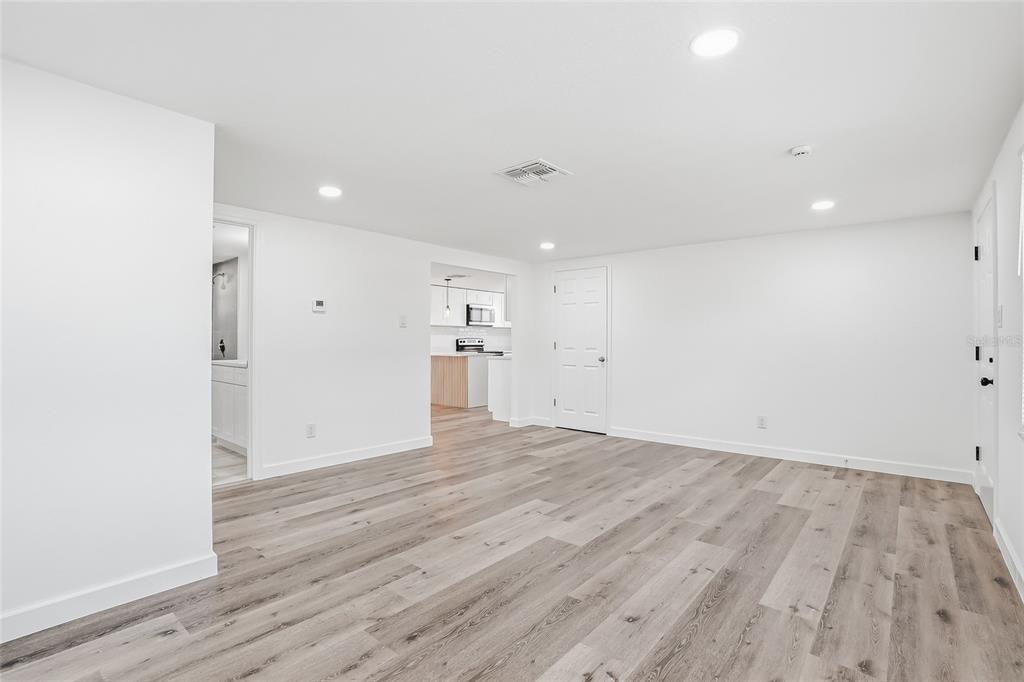 7840 Gulf Way Hudson, FL 34667 - Photo 3 of 37 a view of empty room with wooden floor