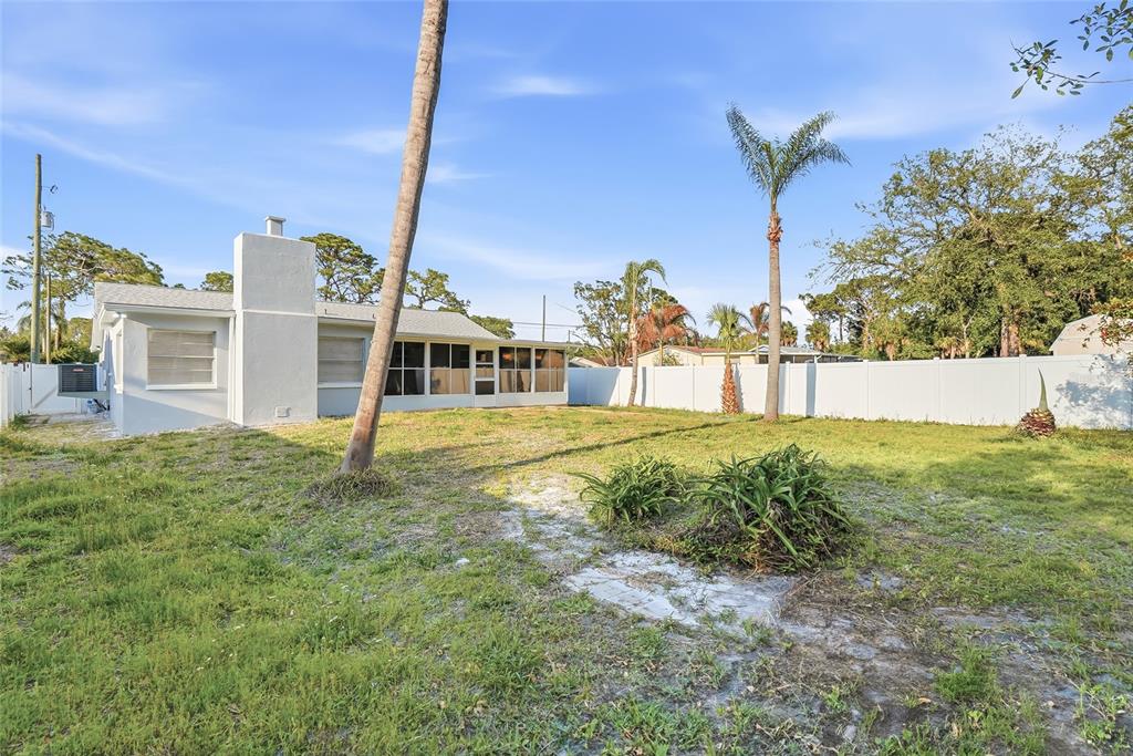 7840 Gulf Way Hudson, FL 34667 - Photo 33 of 37 a view of a house with a yard