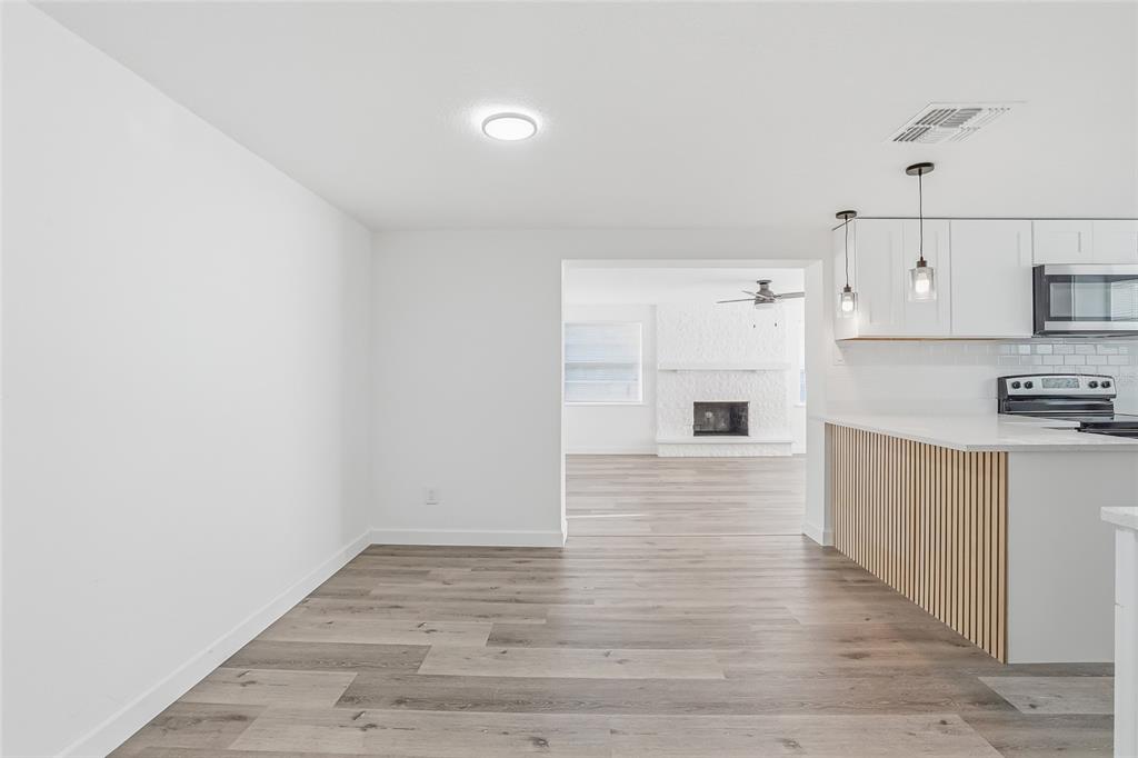 7840 Gulf Way Hudson, FL 34667 - Photo 5 of 37 a view of kitchen with wooden floor