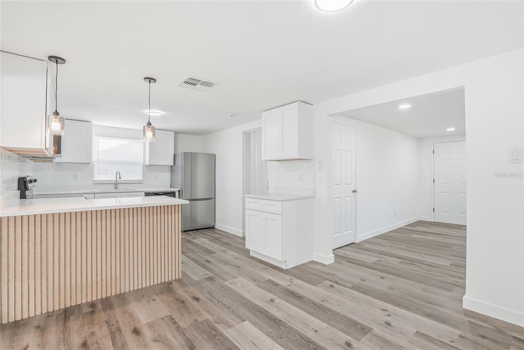 7840 Gulf Way Hudson, FL 34667 - Photo 6 of 37 a view of kitchen with wooden floor