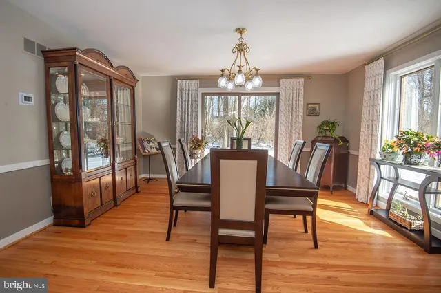 a living room with furniture and book shelf