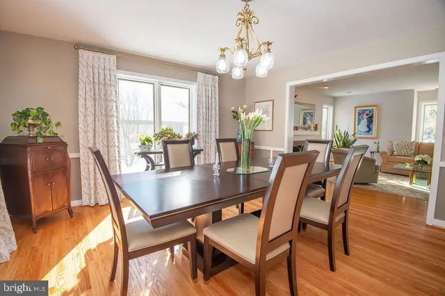 a living room with furniture and a book shelf