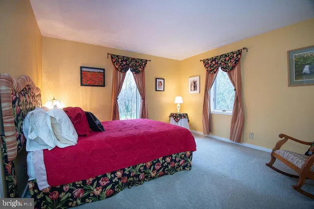 a bathroom with a granite countertop sink a mirror and vanity