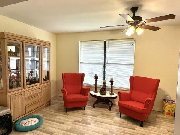 a room that has a bed and a table in it