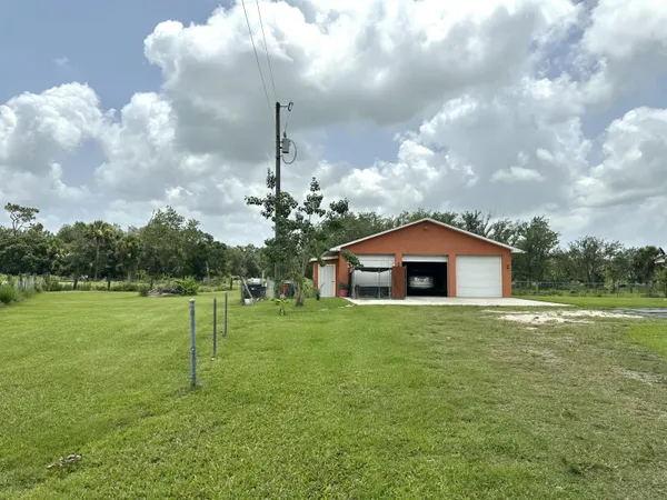 a big house with big yard and big trees