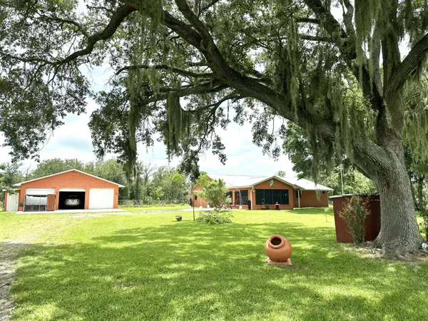 a swimming pool with trees in the background