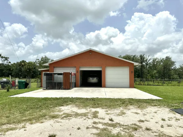 a view of house with yard and entertaining space
