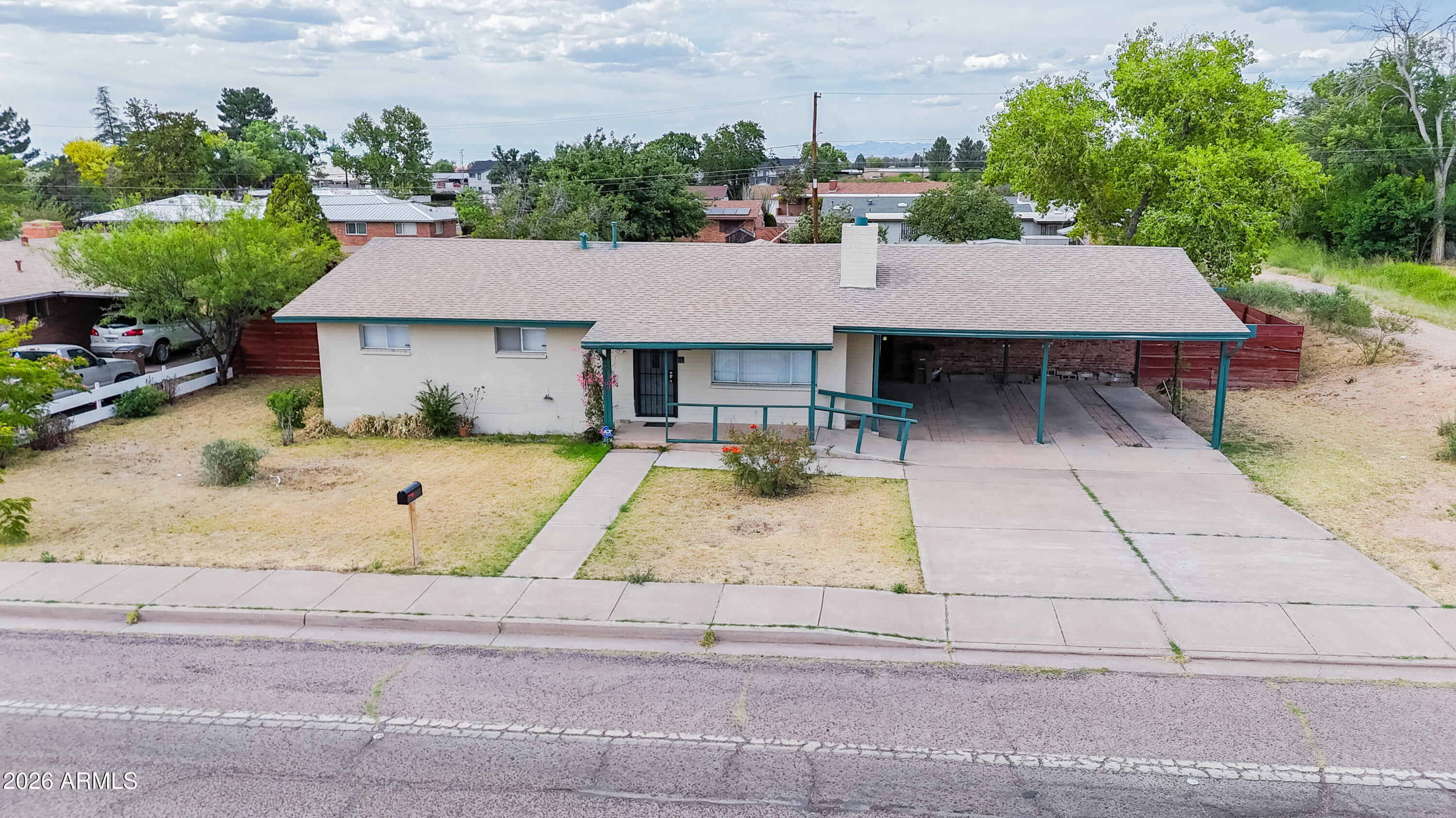 1626 11th Street Douglas, AZ 85607 - Photo 6 of 30 a view of a patio with table and chairs and potted plants