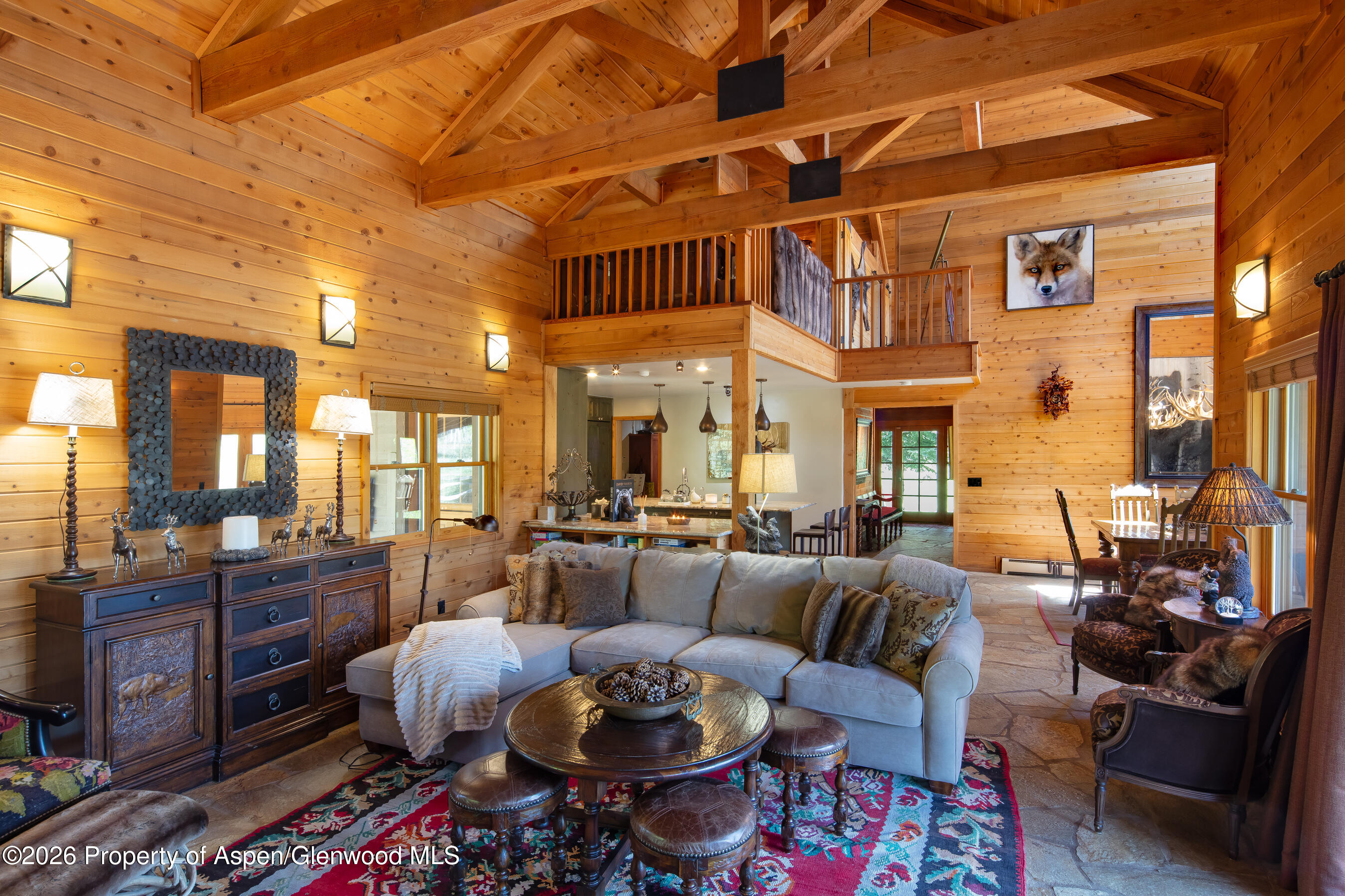 294 Ruedi Creek Road Basalt, CO 81621 - Photo 10 of 27 a living room with furniture a rug and a chandelier