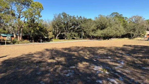 a backyard of a house with lots of green space