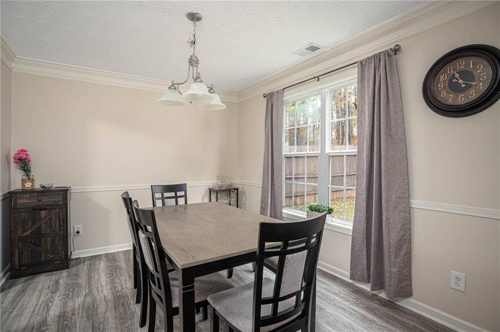 3954 Riverside Parkway Decatur, GA 30034 - Photo 14 of 38 a view of a dining room with furniture window and wooden floor