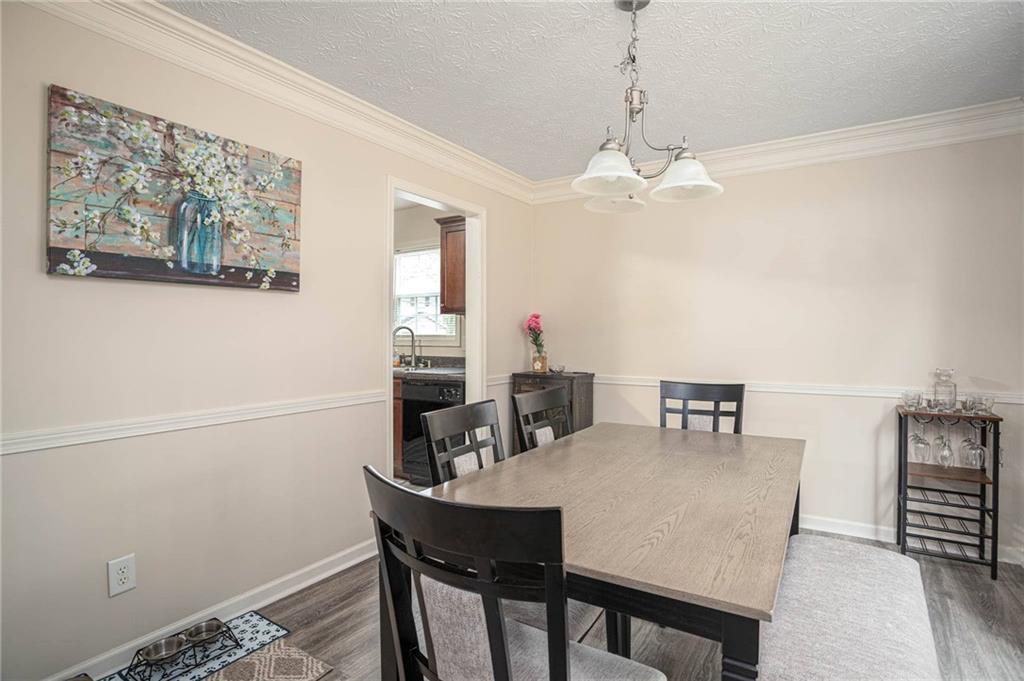 3954 Riverside Parkway Decatur, GA 30034 - Photo 15 of 38 a view of a dining room with furniture and chandelier