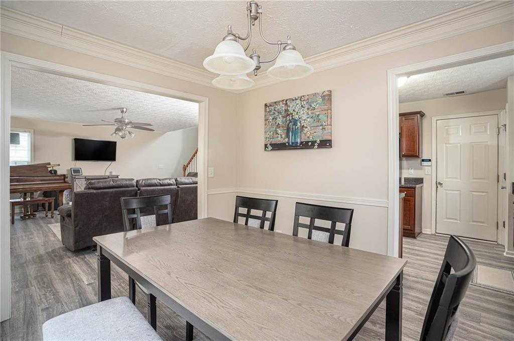 3954 Riverside Parkway Decatur, GA 30034 - Photo 16 of 38 a view of a dining room with furniture and wooden floor