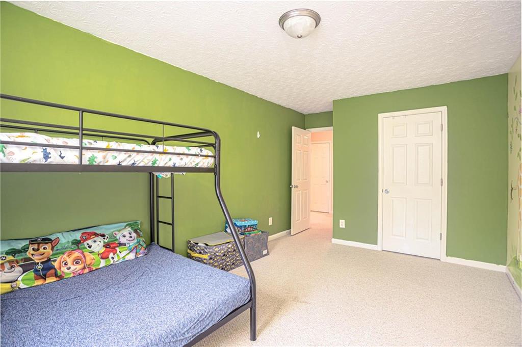 3954 Riverside Parkway Decatur, GA 30034 - Photo 31 of 38 a bedroom with a bed and a window