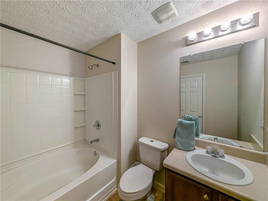 3954 Riverside Parkway Decatur, GA 30034 - Photo 34 of 38 a bathroom with a sink toilet and shower