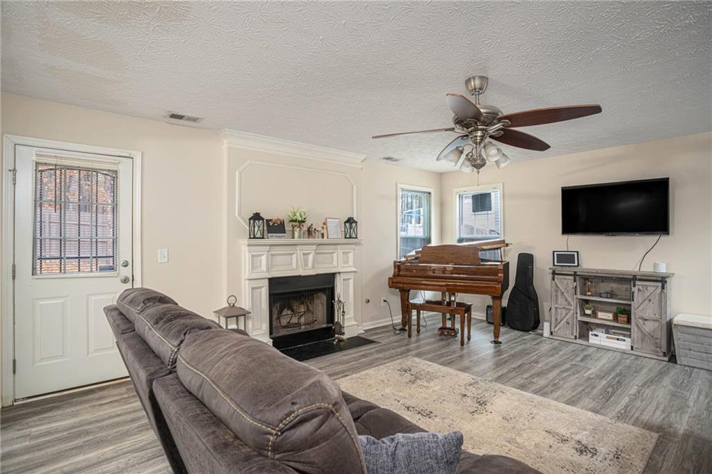 3954 Riverside Parkway Decatur, GA 30034 - Photo 10 of 38 a living room with furniture fireplace and flat screen tv