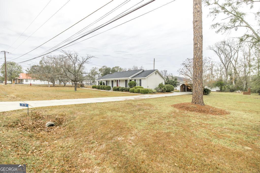 35 Commerce Street Alamo, GA 30411 - Photo 12 of 37 a view of an ocean with a house