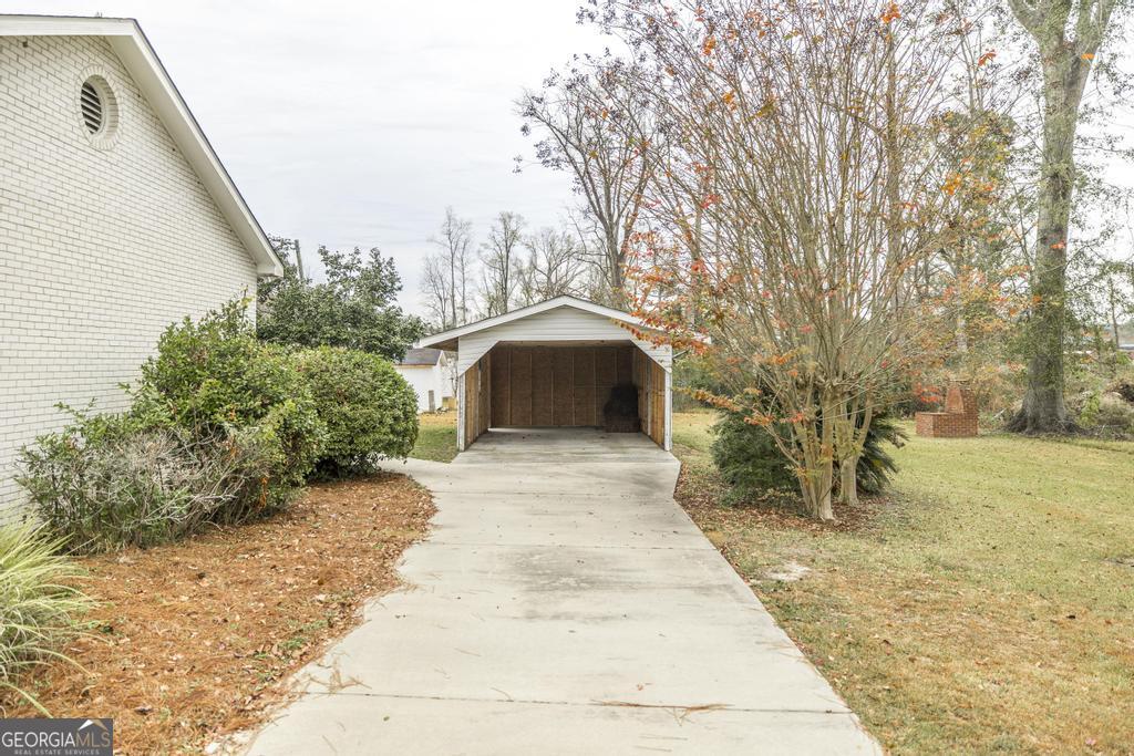 35 Commerce Street Alamo, GA 30411 - Photo 15 of 37 a view of entryway with garden