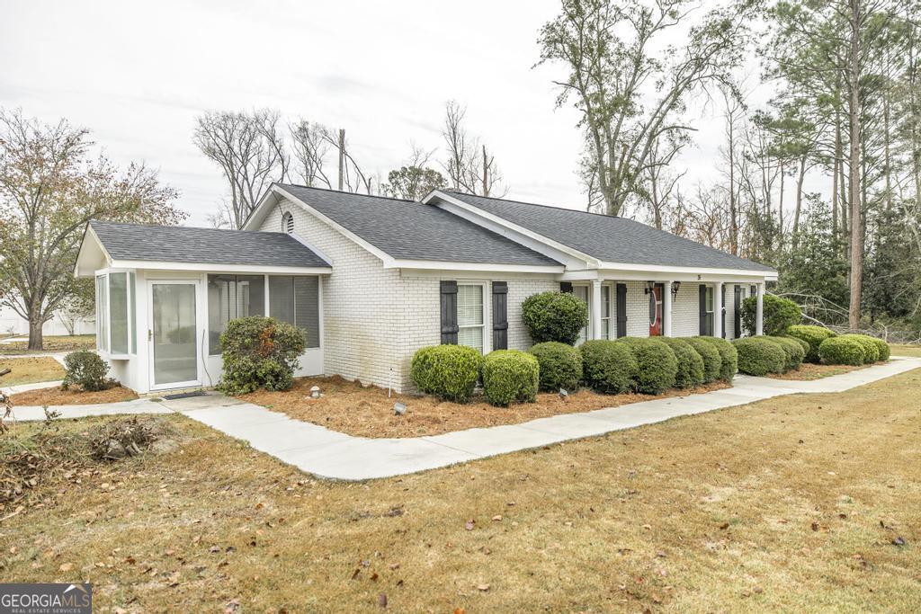 35 Commerce Street Alamo, GA 30411 - Photo 2 of 37 a view of a house with a patio