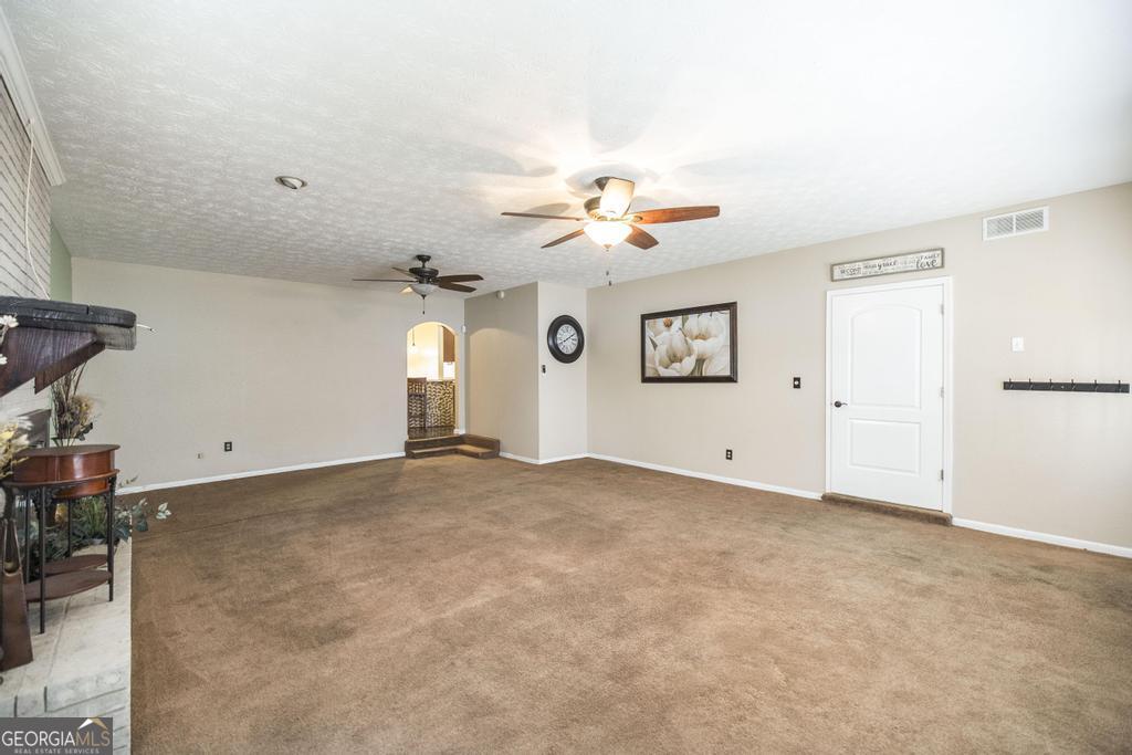 35 Commerce Street Alamo, GA 30411 - Photo 29 of 37 a view of empty room with ceiling fan