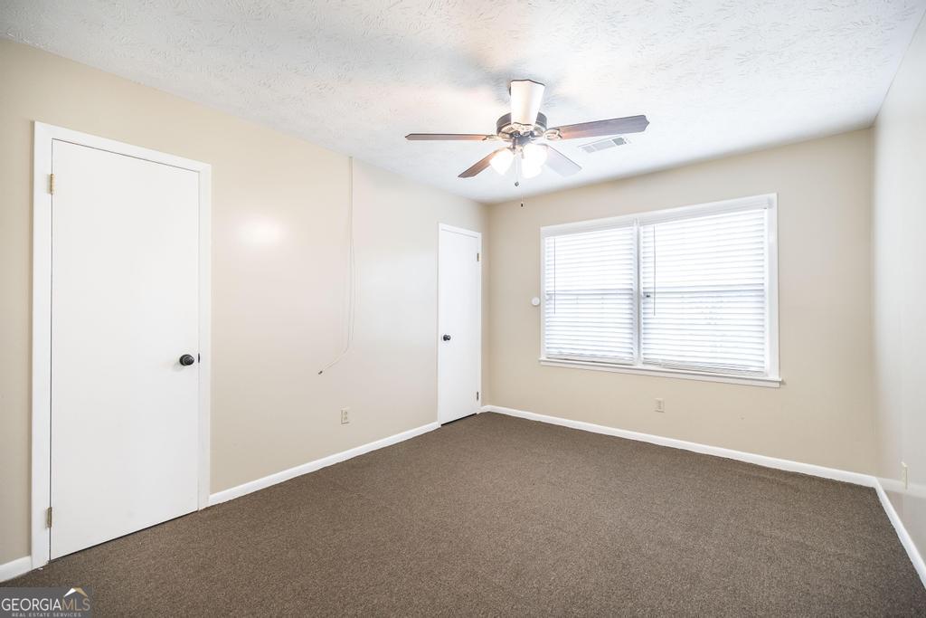 35 Commerce Street Alamo, GA 30411 - Photo 34 of 37 a view of an empty room with a window
