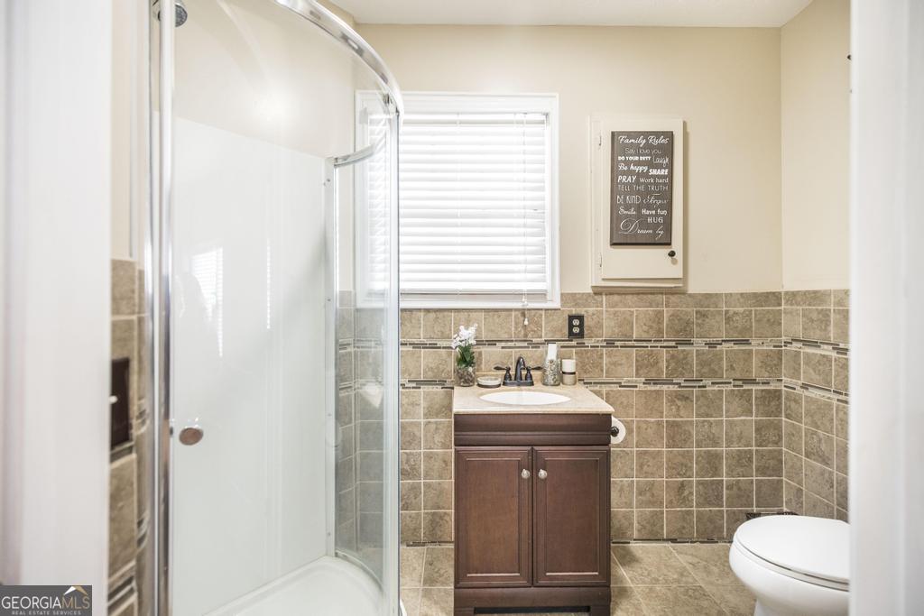 35 Commerce Street Alamo, GA 30411 - Photo 37 of 37 a bathroom with a sink toilet and shower