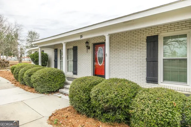 a view of a house with a garden