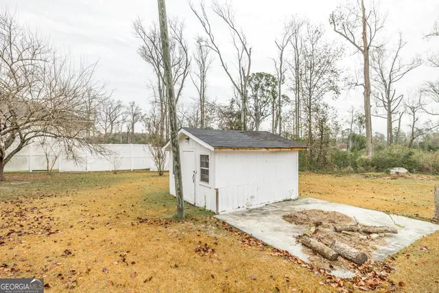 a view of a yard with snow on the road