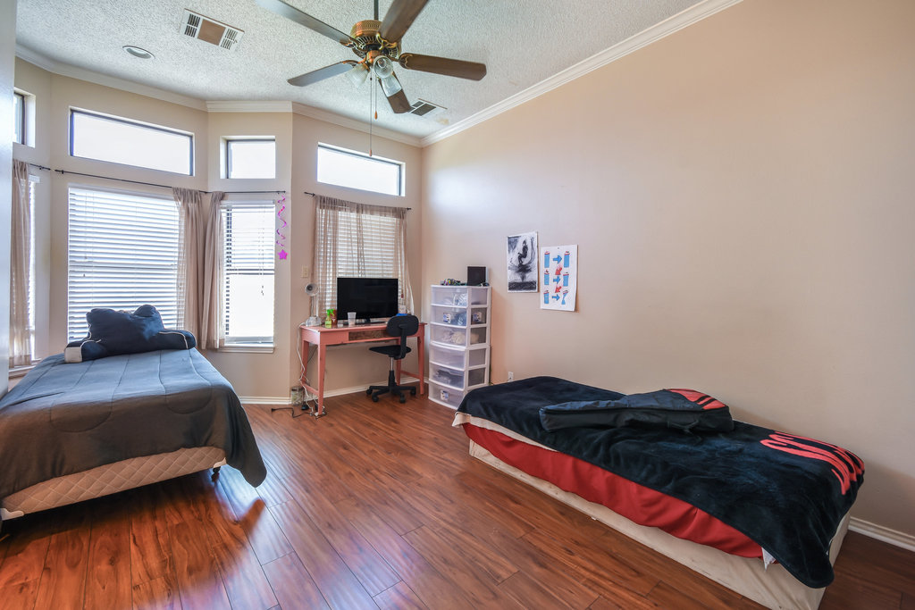2802 Nueces Street, Unit 312 Austin, TX 78705 - Photo 16 of 22 a living room with a bed furniture and a large window