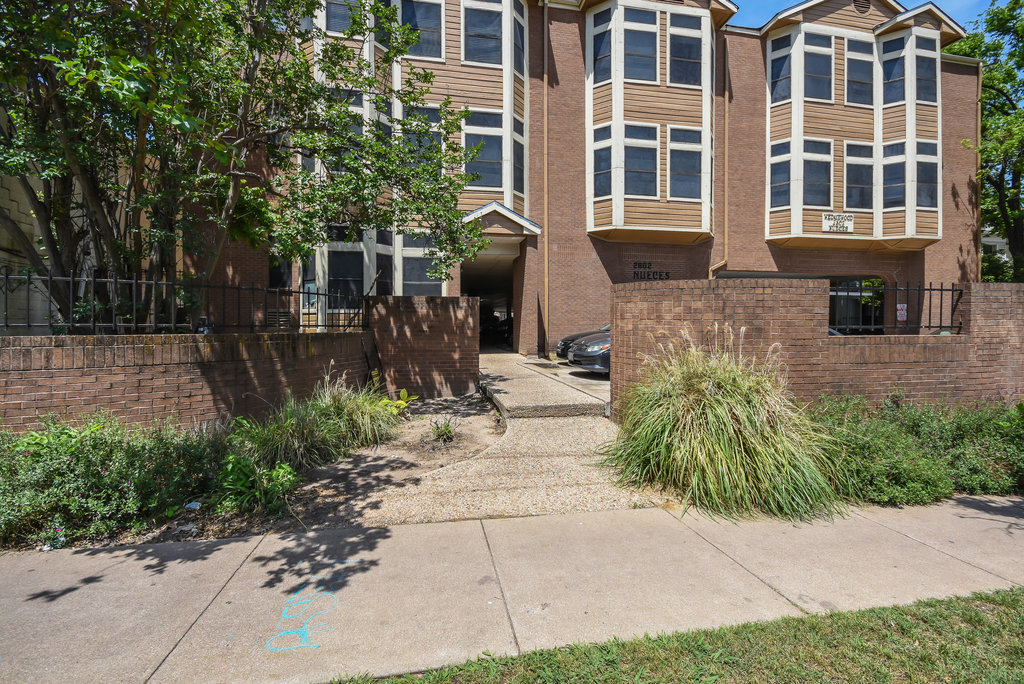 2802 Nueces Street, Unit 312 Austin, TX 78705 - Photo 2 of 22 a front view of a building with garden