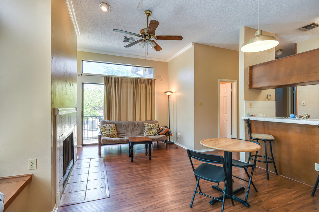 2802 Nueces Street, Unit 312 Austin, TX 78705 - Photo 7 of 22 a living room with furniture and a large window