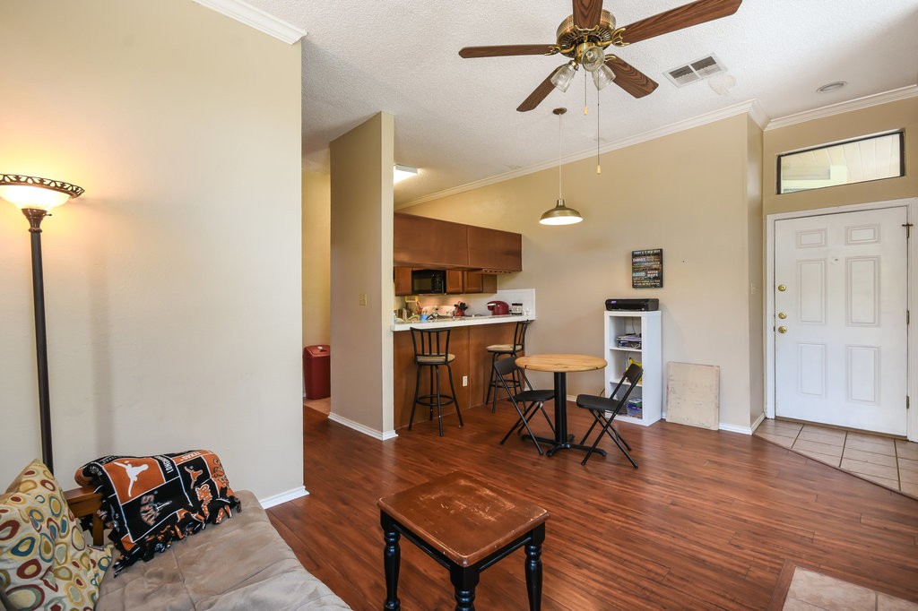 2802 Nueces Street, Unit 312 Austin, TX 78705 - Photo 8 of 22 a living room with furniture and kitchen view