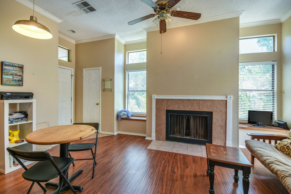 2802 Nueces Street, Unit 312 Austin, TX 78705 - Photo 9 of 22 a view of a livingroom with furniture and a fireplace