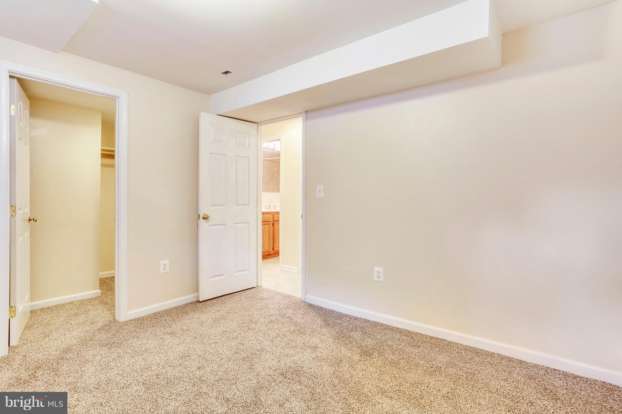 8531 Creek Road Pasadena, MD 21122 - Photo 12 of 29 Basement Bedroom w/walk in Closet