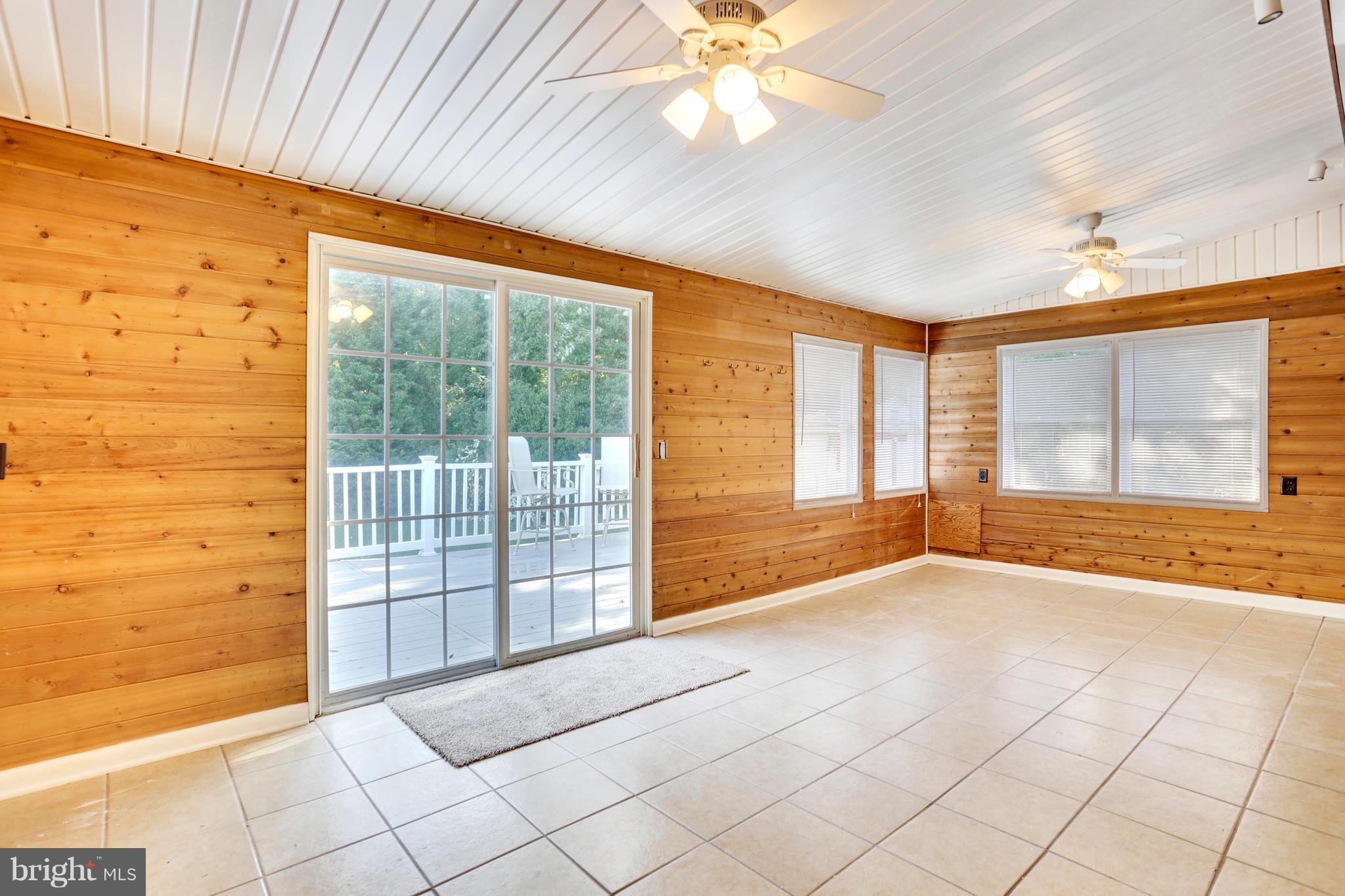 8531 Creek Road Pasadena, MD 21122 - Photo 18 of 29 Sunroom leading to Deck