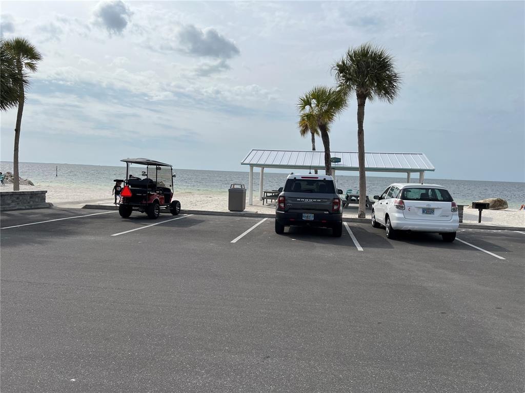 4726 Marine Parkway, Unit 104 New Port Richey, FL 34652 - Photo 12 of 19 a car driving down a road next to a building