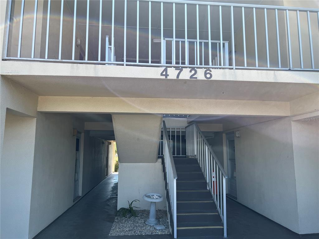 4726 Marine Parkway, Unit 104 New Port Richey, FL 34652 - Photo 3 of 19 a view of entryway with a wooden floor