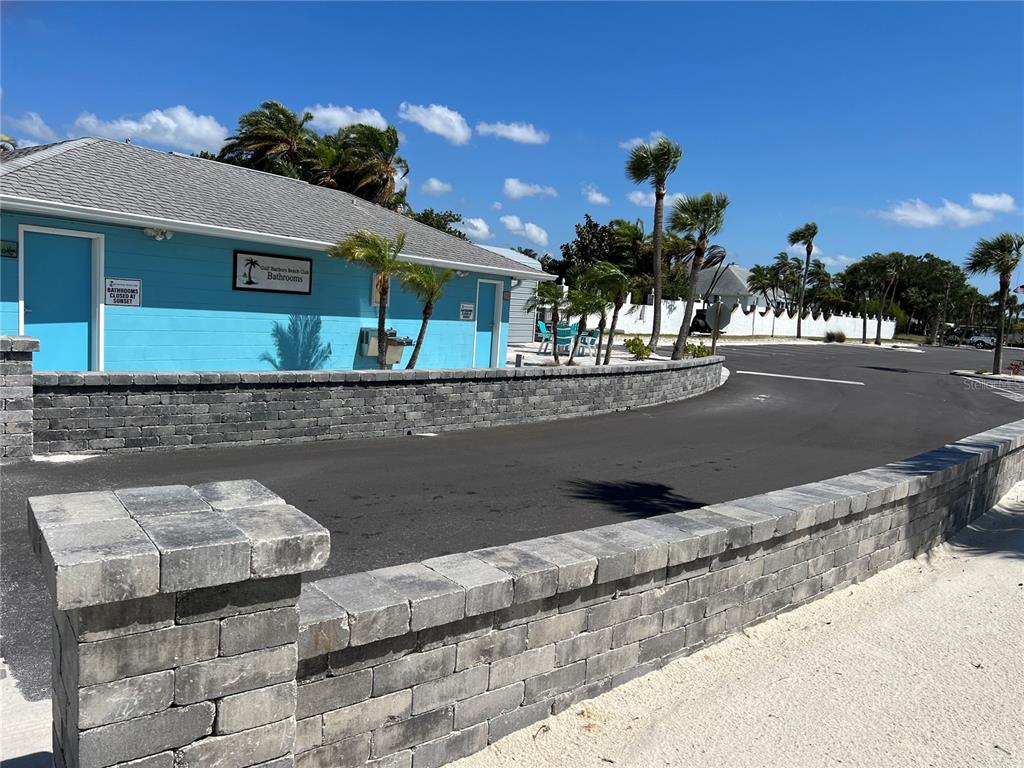 4726 Marine Parkway, Unit 104 New Port Richey, FL 34652 - Photo 10 of 19 a front view of a house with a yard and garage
