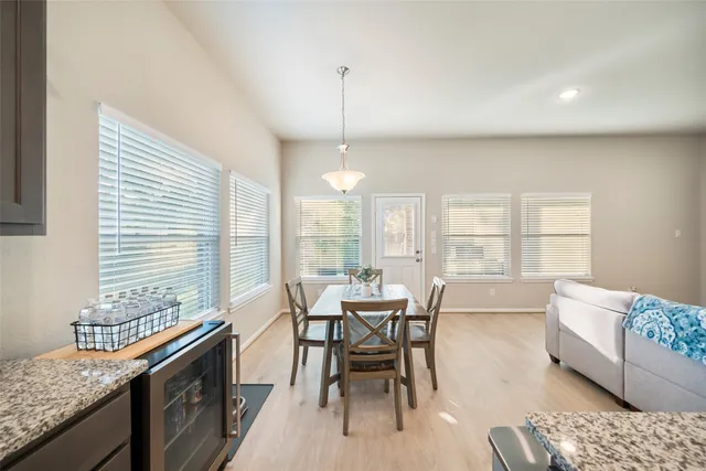 a dining room with furniture and window