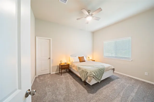 a room with a bed and a chandelier