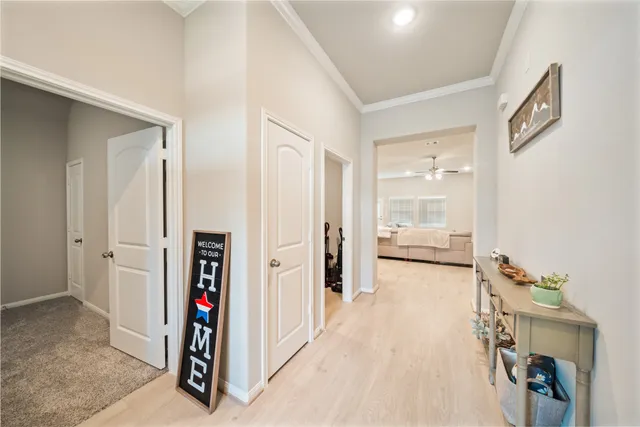 a view of an entryway with wooden floor