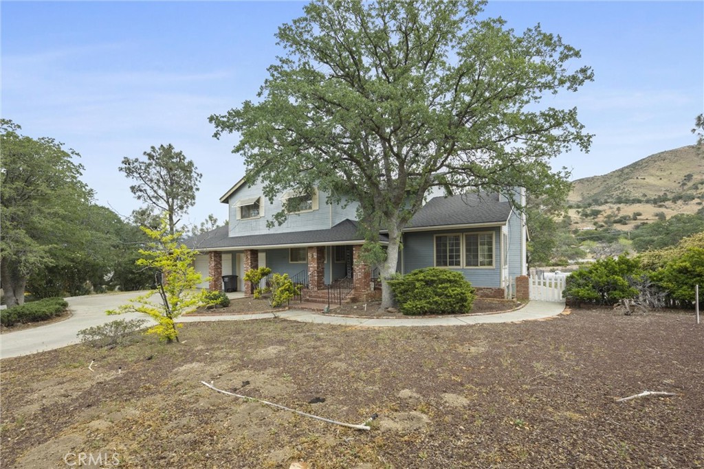 3512 McCray Road Mountain Mesa, CA 93240 - Photo 11 of 60 a front view of a house with garden