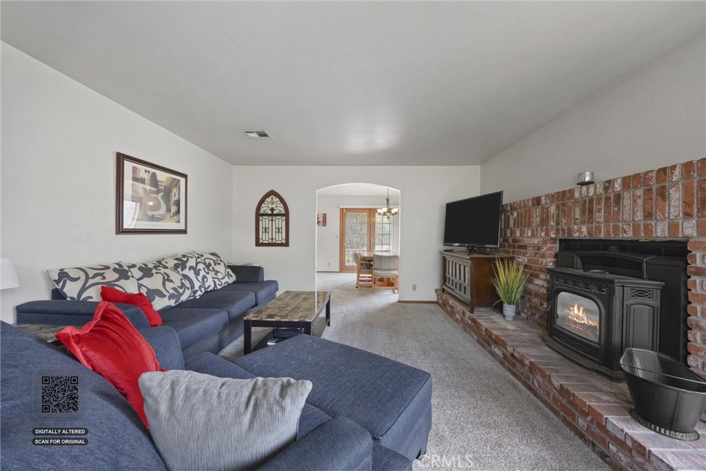 3512 McCray Road Mountain Mesa, CA 93240 - Photo 16 of 60 a living room with furniture a flat screen tv and a fireplace