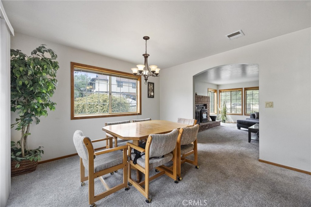 3512 McCray Road Mountain Mesa, CA 93240 - Photo 21 of 60 a dining room with furniture a chandelier and window