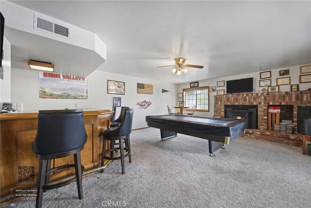 3512 McCray Road Mountain Mesa, CA 93240 - Photo 22 of 60 a living room with furniture and a fireplace