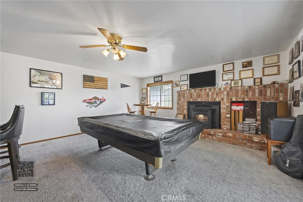 3512 McCray Road Mountain Mesa, CA 93240 - Photo 23 of 60 a living room with furniture a flat screen tv and a fireplace