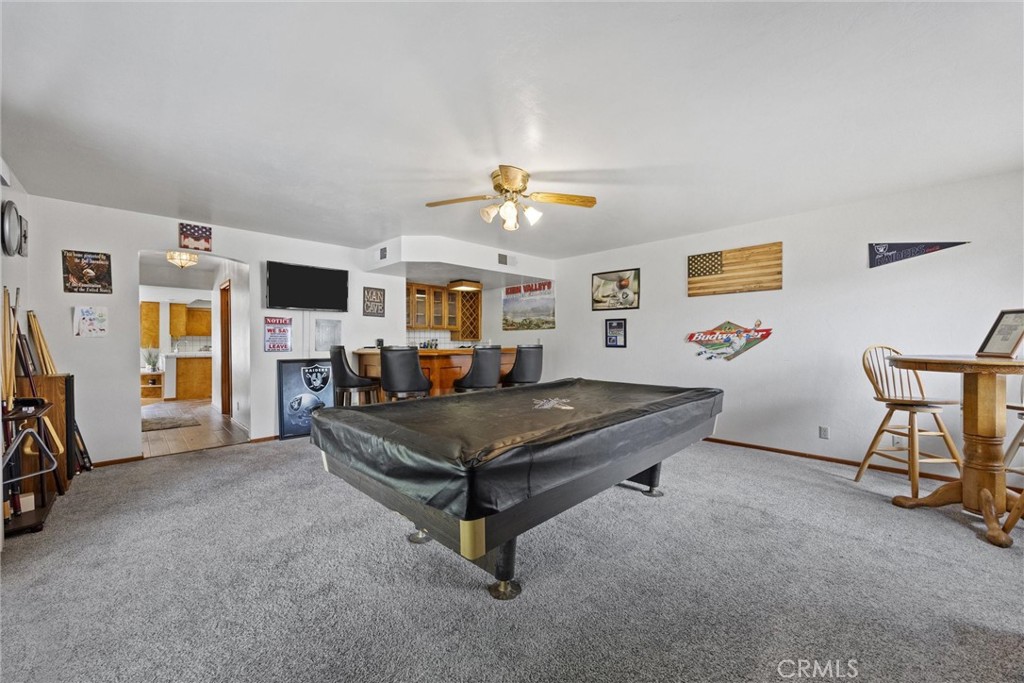 3512 McCray Road Mountain Mesa, CA 93240 - Photo 25 of 60 a living room with furniture and a flat screen tv